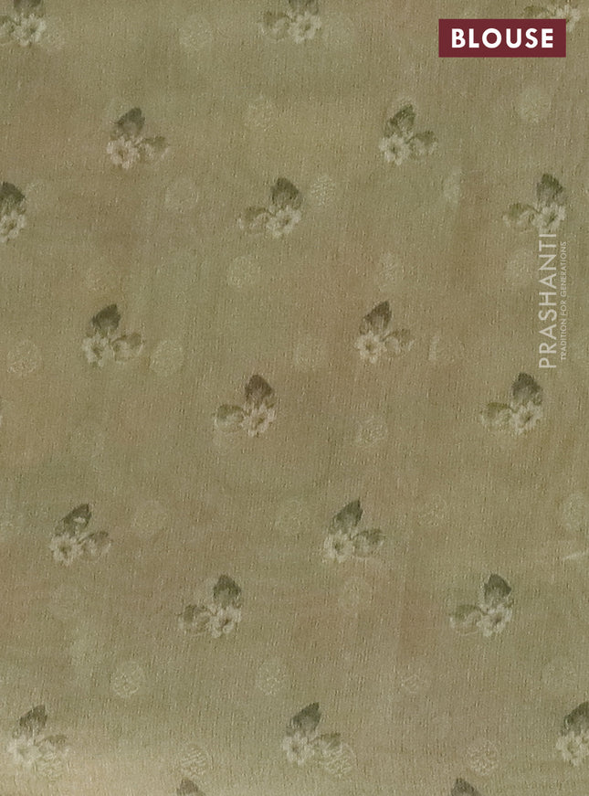 Tissue saree sandal and pastel green with allover zari weaves and floral digital printed border