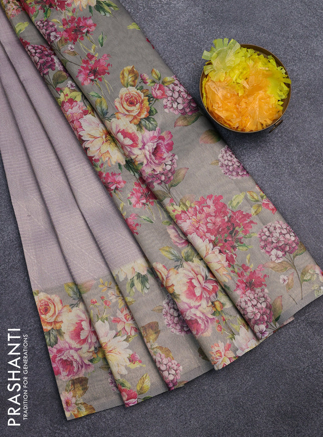 Tissue saree pastel lavender and grey shade with allover zari weaves and floral digital printed border