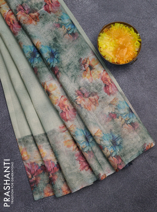 Tissue saree pastel green and grey with allover zari weaves and floral digital printed border