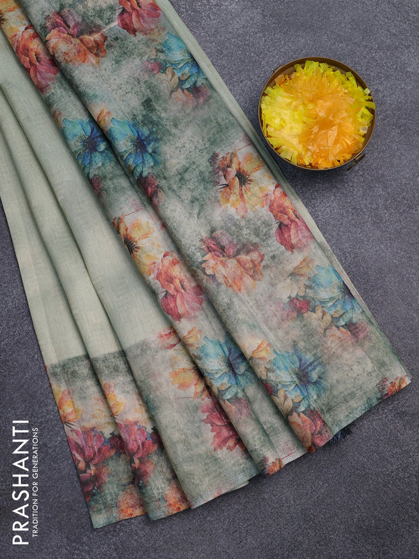 Tissue saree pastel green and grey with allover zari weaves and floral digital printed border