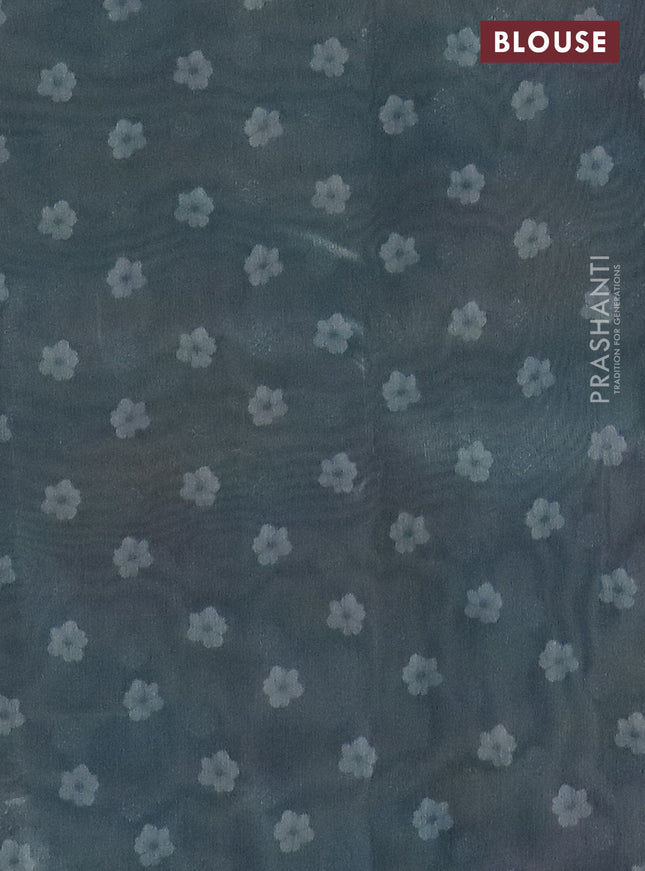 Tissue saree pastel green and grey with allover zari weaves and floral digital printed border