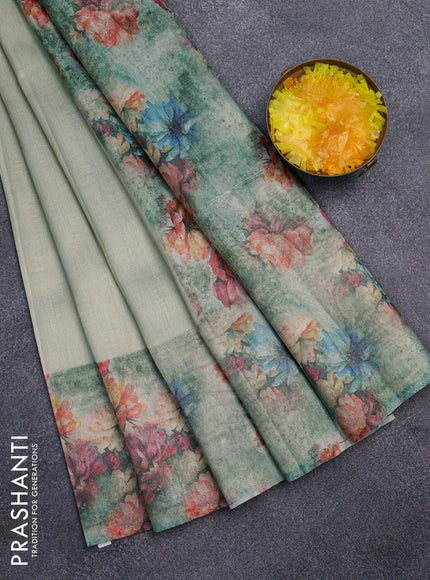 Tissue saree teal shade and teal green with allover zari weaves and floral digital printed border