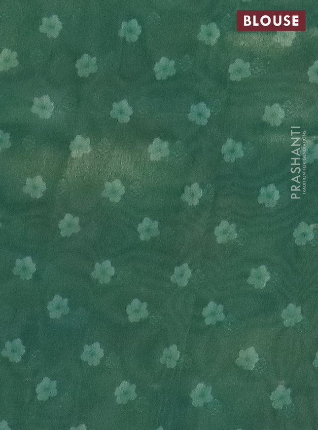 Tissue saree teal shade and teal green with allover zari weaves and floral digital printed border