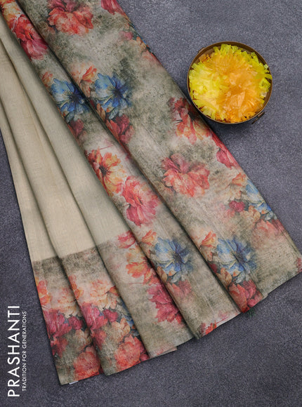 Tissue saree cream and pastel green with allover zari weaves and floral digital printed border