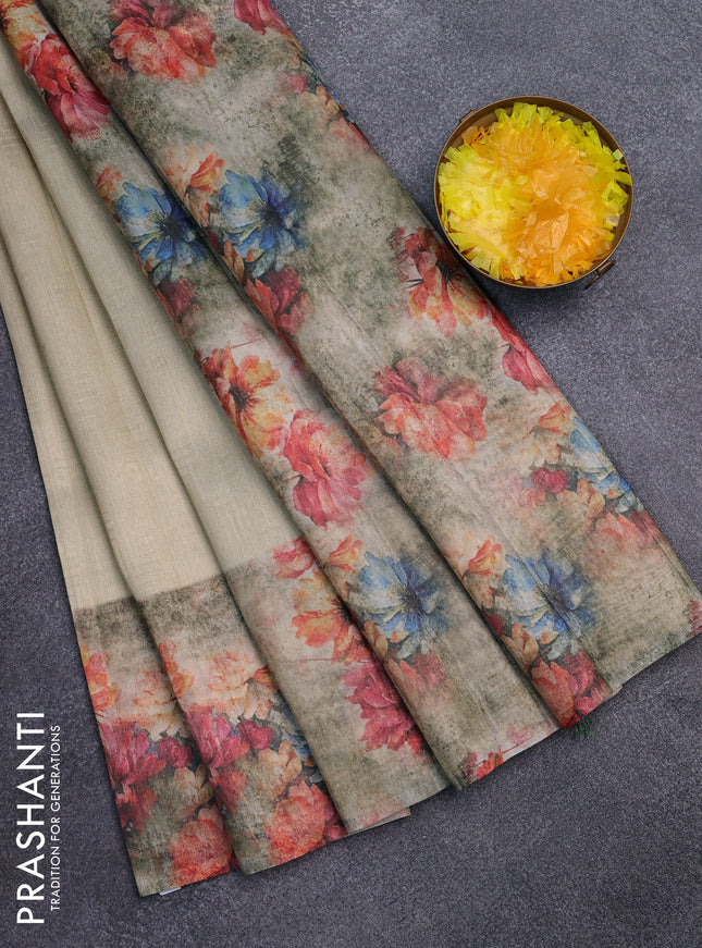 Tissue saree cream and pastel green with allover zari weaves and floral digital printed border