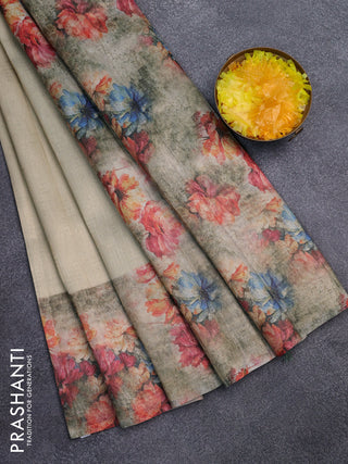 Tissue saree cream and pastel green with allover zari weaves and floral digital printed border