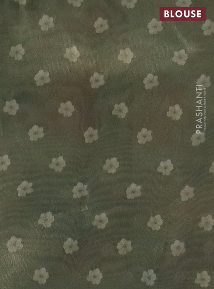 Tissue saree cream and pastel green with allover zari weaves and floral digital printed border