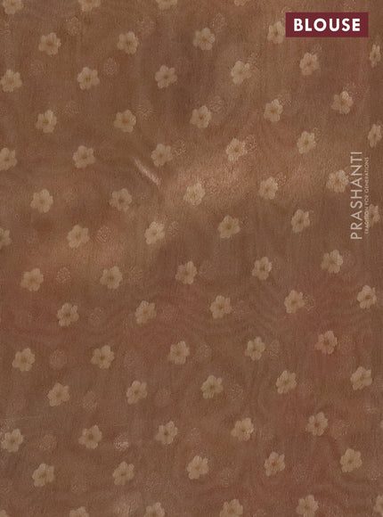 Tissue saree cream and sandal with allover zari weaves and floral digital printed border