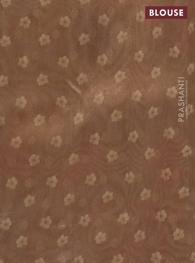 Tissue saree cream and sandal with allover zari weaves and floral digital printed border