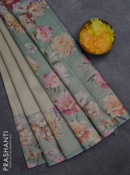 Tissue saree pista green shade and pastel green with allover zari weaves and floral digital printed border