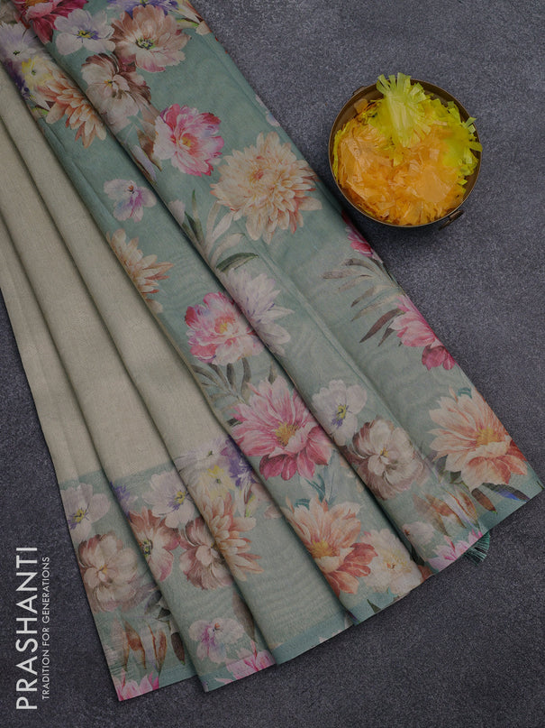 Tissue saree pista green shade and pastel green with allover zari weaves and floral digital printed border