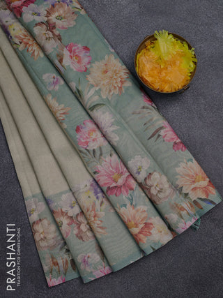 Tissue saree pista green shade and pastel green with allover zari weaves and floral digital printed border