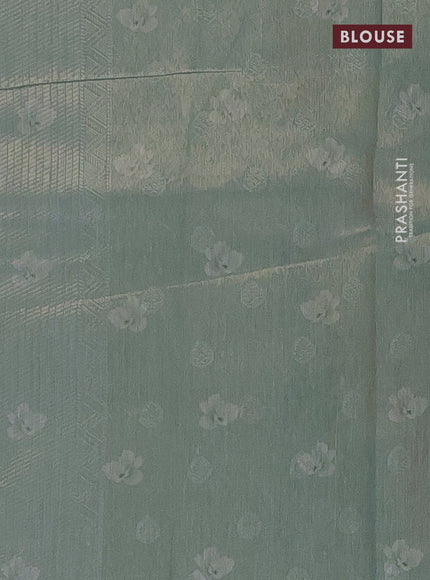 Tissue saree pista green shade and pastel green with allover zari weaves and floral digital printed border