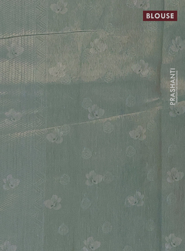 Tissue saree pista green shade and pastel green with allover zari weaves and floral digital printed border