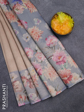 Tissue saree sandal and pastel blue with allover zari weaves and floral digital printed border