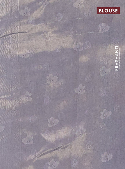 Tissue saree sandal and pastel blue with allover zari weaves and floral digital printed border