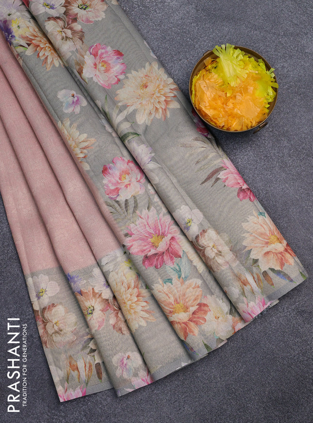 Tissue saree pastel peach and grey with allover zari weaves and floral digital printed border