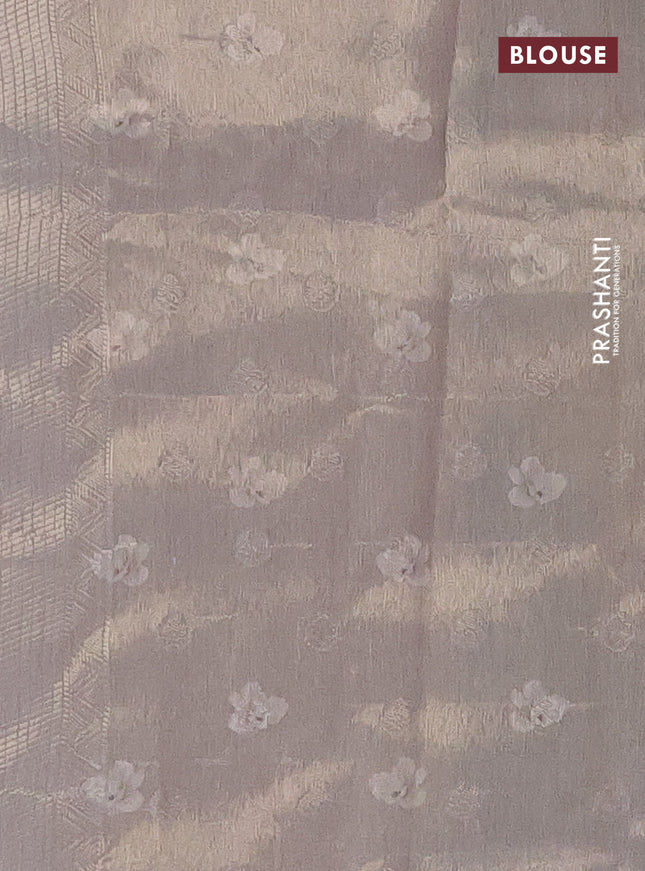 Tissue saree pastel peach and grey with allover zari weaves and floral digital printed border