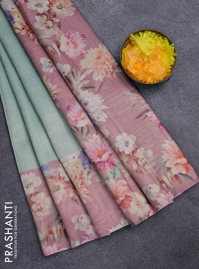 Tissue saree teal shade and pink with allover zari weaves and floral digital printed border