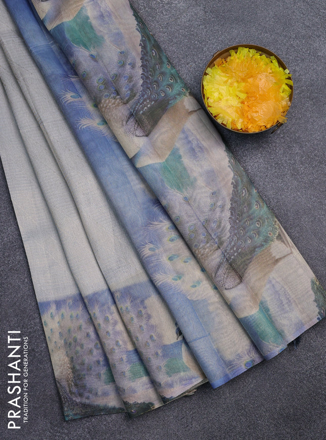 Tissue saree pastel grey with allover zari weaves and digital printed border