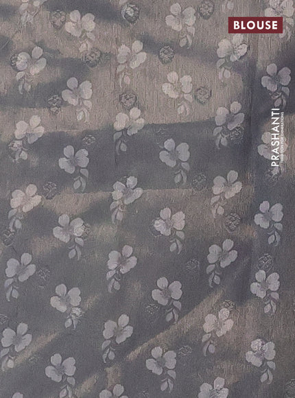 Tissue saree pastel grey with allover zari weaves and digital printed border