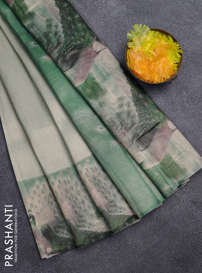 Tissue saree mild pista green with allover zari weaves and digital printed border