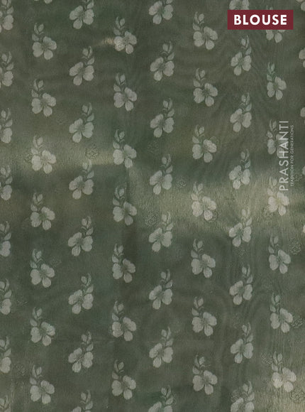 Tissue saree mild pista green with allover zari weaves and digital printed border