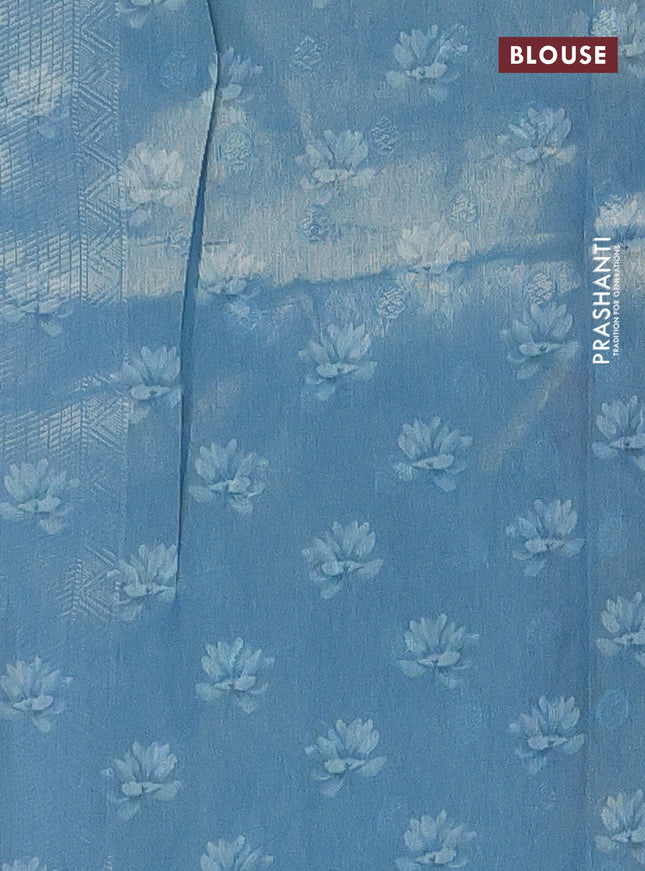 Tissue saree light blue with allover zari weaves and floral digital printed border