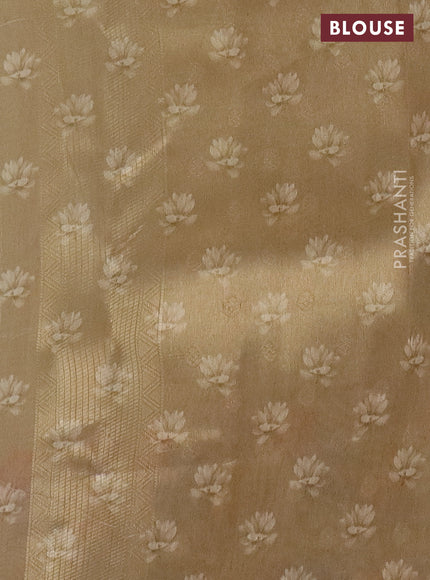 Tissue saree gold with allover zari weaves and floral digital printed border