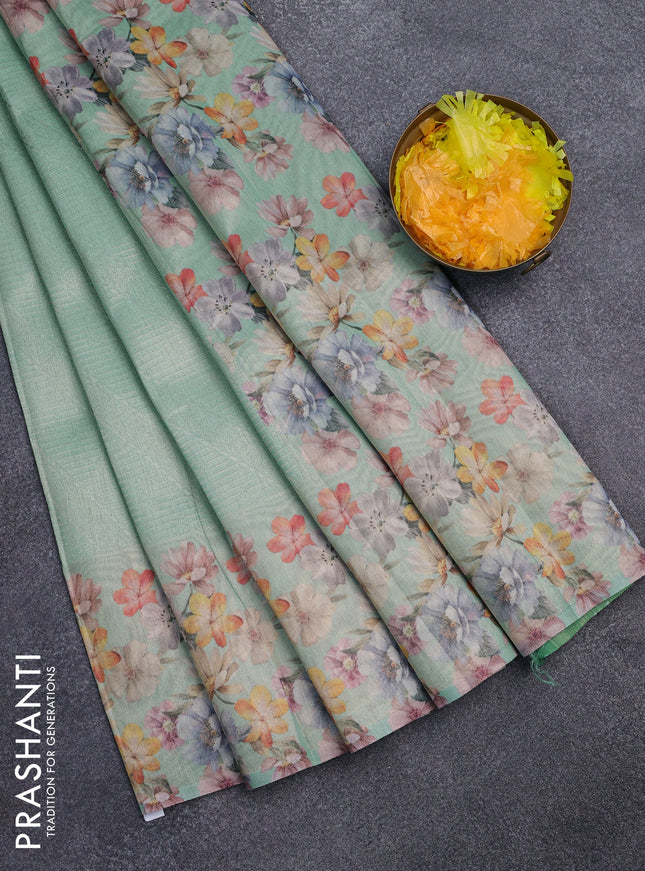 Tissue saree teal green shade with allover zari weaves and floral digital printed border
