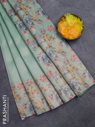 Tissue saree teal green shade with allover zari weaves and floral digital printed border