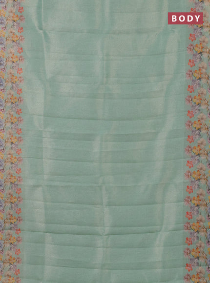 Tissue saree teal green shade with allover zari weaves and floral digital printed border