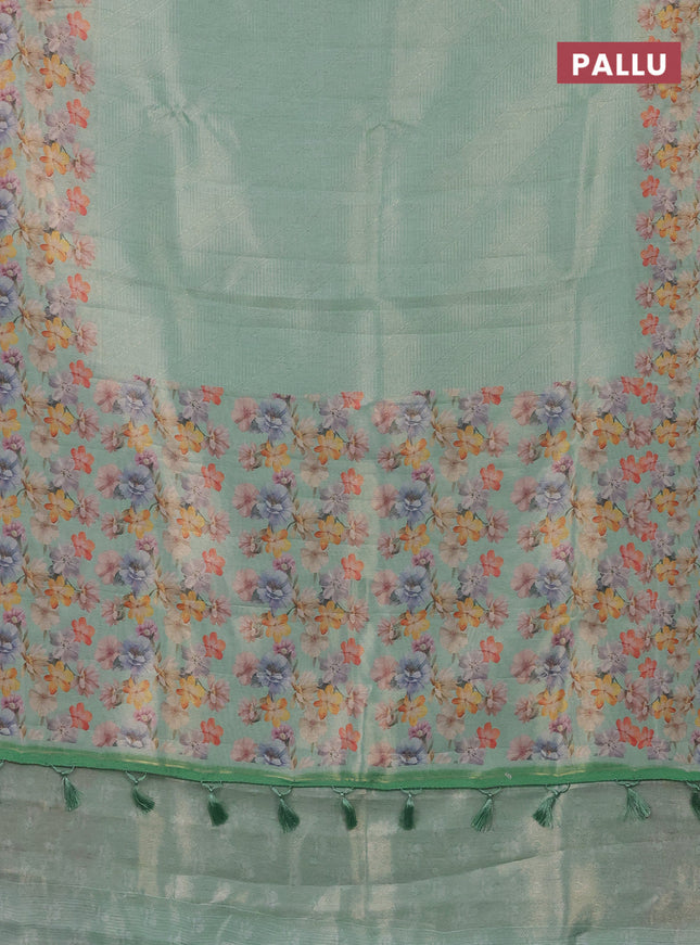 Tissue saree teal green shade with allover zari weaves and floral digital printed border