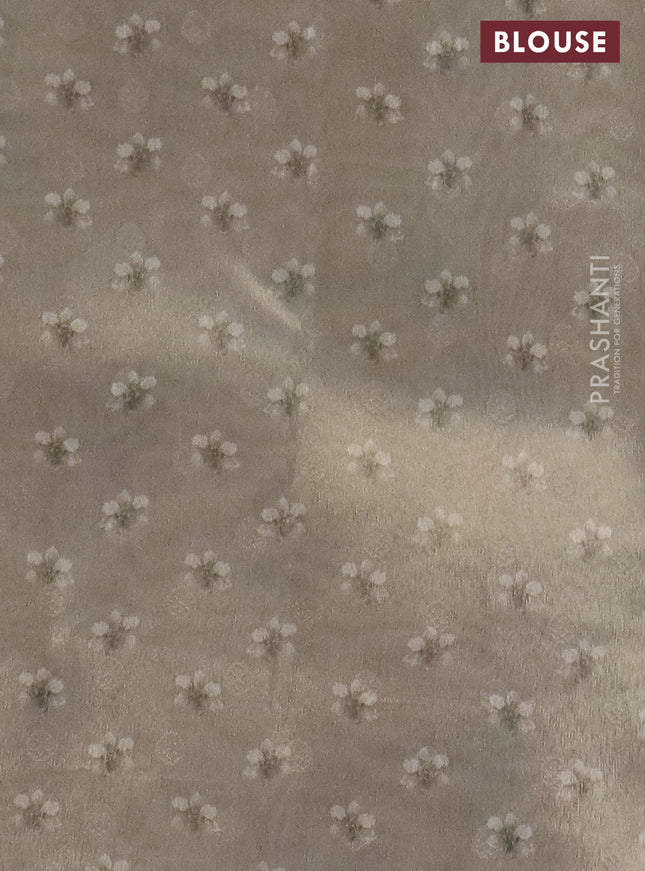 Tissue saree beige with allover zari weaves and floral digital printed border