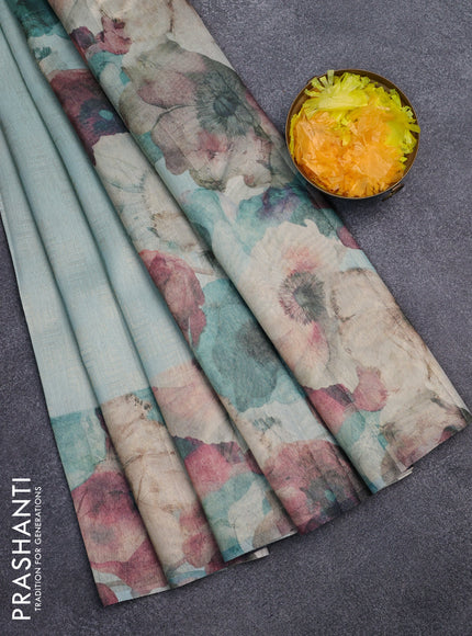 Tissue saree teal blue with allover zari weaves and floral digital printed border