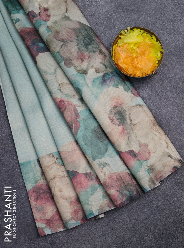 Tissue saree teal blue with allover zari weaves and floral digital printed border