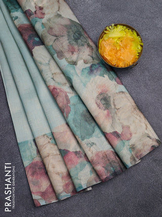 Tissue saree teal blue with allover zari weaves and floral digital printed border