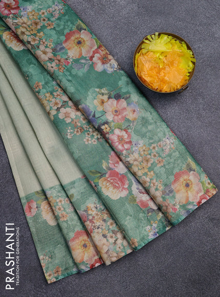 Tissue saree pastel green and green with allover zari weaves and floral digital printed border