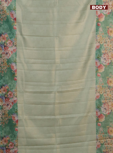 Tissue saree pastel green and green with allover zari weaves and floral digital printed border