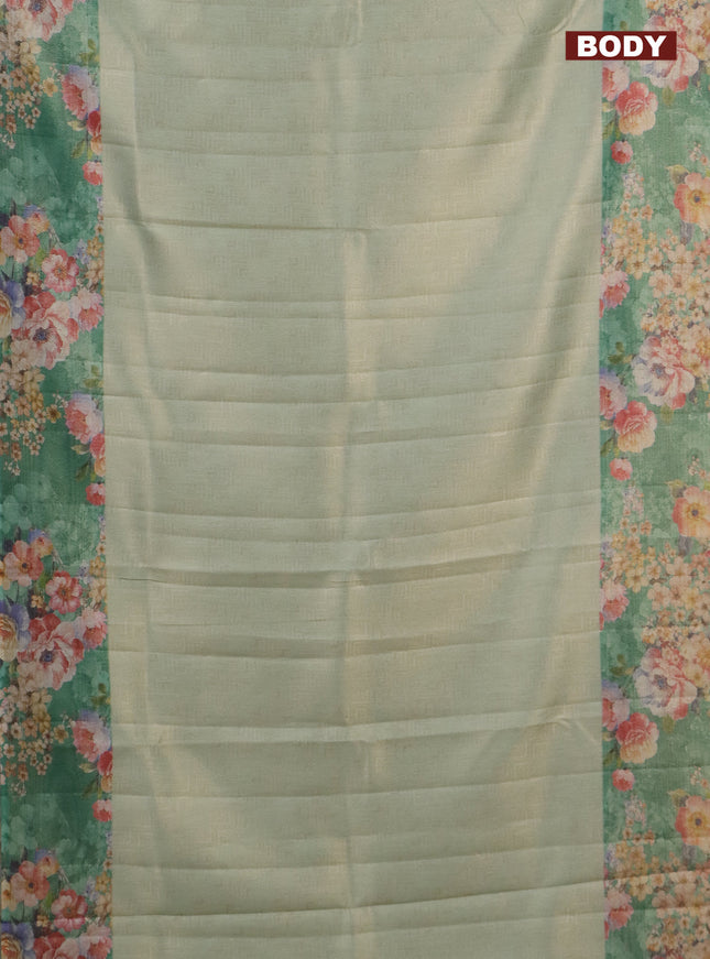Tissue saree pastel green and green with allover zari weaves and floral digital printed border