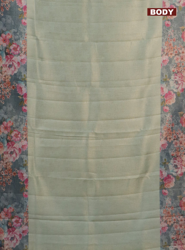 Tissue saree pista green and grey with allover zari weaves and floral digital printed border