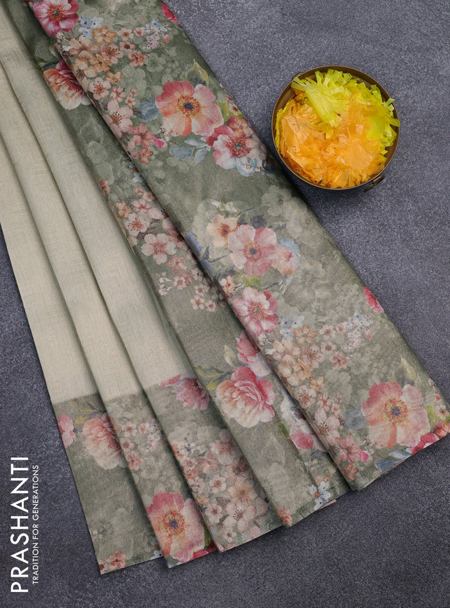 Tissue saree pastel pista green and green shade with allover zari weaves and floral digital printed border
