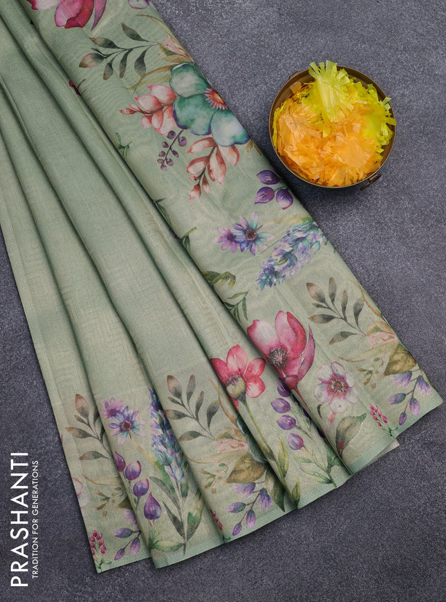 Tissue saree pastel green with allover zari weaves and digital printed border