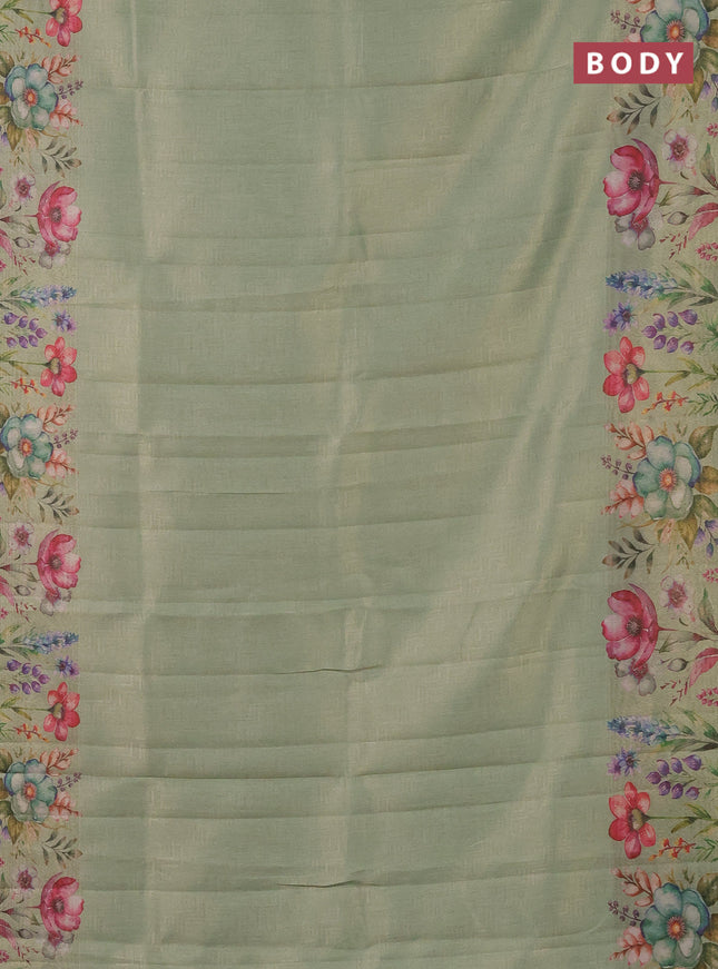 Tissue saree pastel green with allover zari weaves and digital printed border