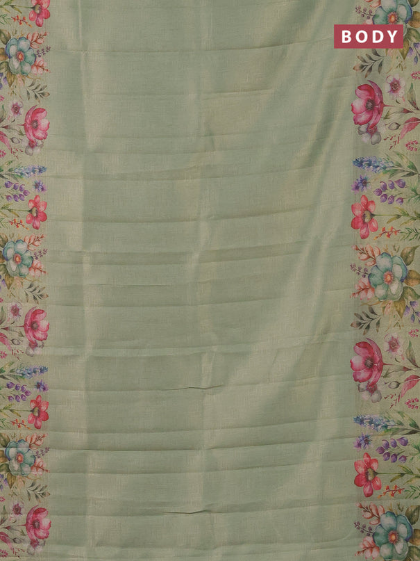 Tissue saree pastel green with allover zari weaves and digital printed border