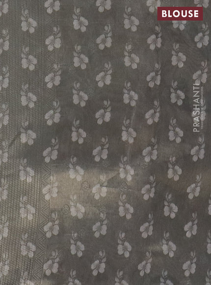 Tissue saree pastel grey and green shade with allover zari weaves and digital printed border