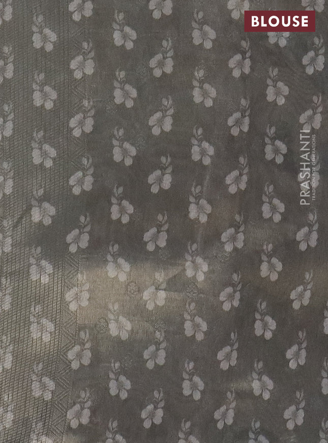 Tissue saree pastel grey and green shade with allover zari weaves and digital printed border