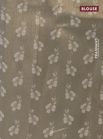 Tissue saree cream and green with allover zari weaves and digital printed border