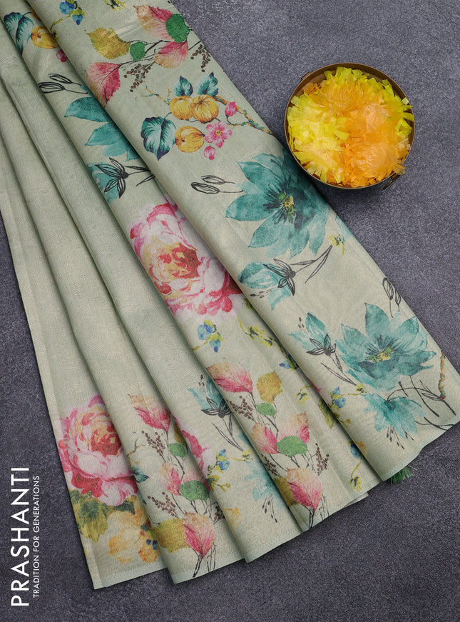 Tissue saree pista green with allover zari weaves and digital printed border