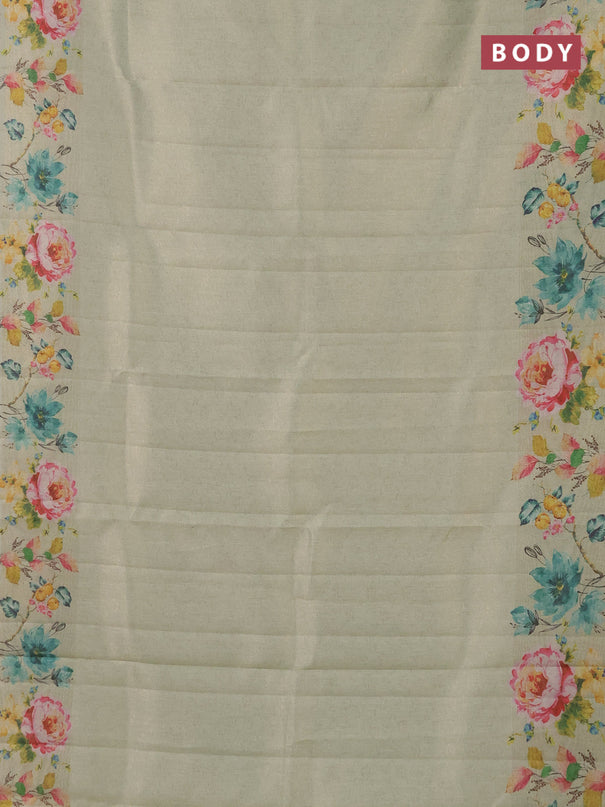 Tissue saree pista green with allover zari weaves and digital printed border